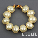 high quality egg shape light yellow sea shell beads bracelet with gold plated clasp