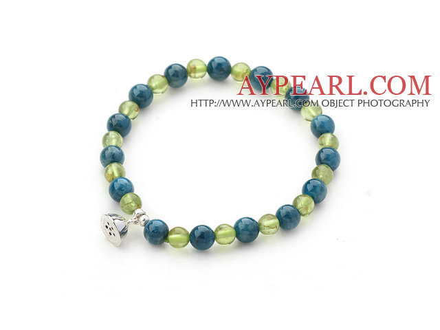 Single Strand Kyanite and Peridot Beaded Stretch Bangle Bracelet with Silver Lotus Seedpod Accessory