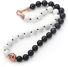 12mm Round Black Agate and White Porcelain Stone Beaded Knotted Necklace with Golden Rose Color Metal Ball
