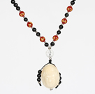 Wholesale Obsidian Beads and Agate Necklace with Corozo Nut Laugh Baddha Pendant and Silver Beads