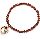 Wholesale beautiful round goldstone and tibet silver peach heart charm beaded bracelet