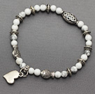soft round white turquoise and multi tibet silver fish heart charm beaded bracelet
